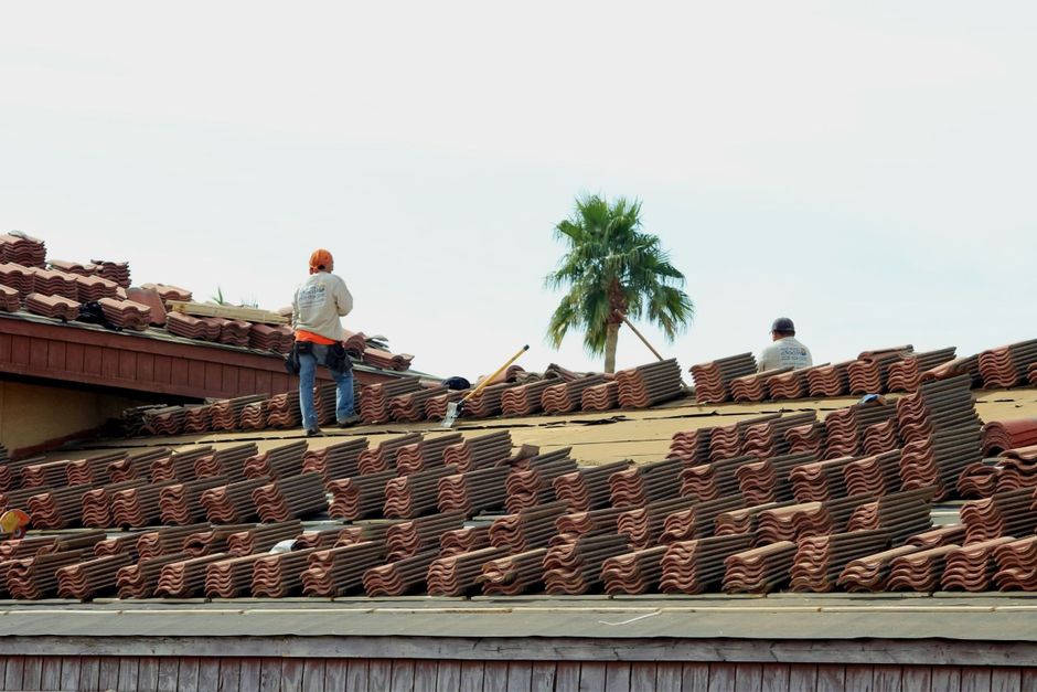 Professional property management team evaluating contractor quality standards